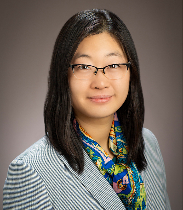 Photo of professor Ying Diao, a woman with black hair and glasses