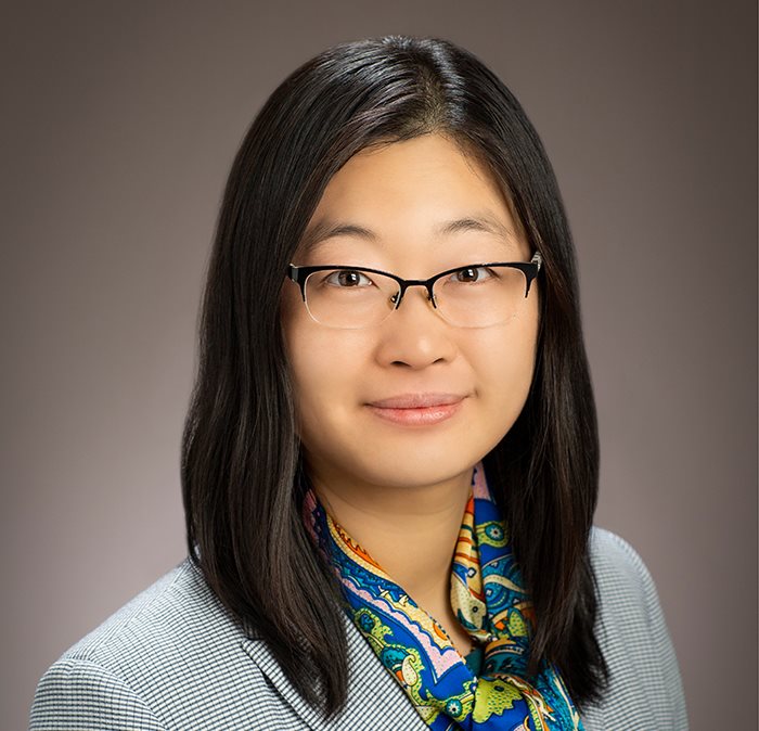 Photo of professor Ying Diao, a woman with black hair and glasses