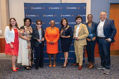 A group of alumni honorees smile alongside council members and the LAS Dean.