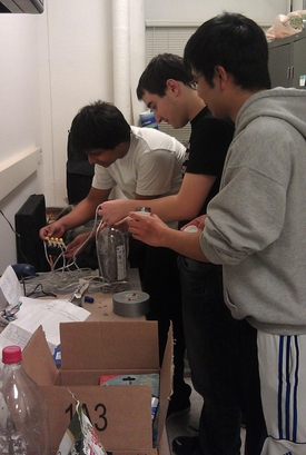 Hari Agarwal, Josh Moller and AG Navarro (pictured from left to right) are getting ready for the University's annual Engineering Open House March 8 and 9. They are working on a project called Fuel for the Future, in which they demonstrate the process of making biofuels and are creating a mini photobioreactor to grow algae, cultivate the algae biomass, and extract oil from it. 