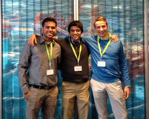 (From left to right) Akash Moradia, Nicholas Connolly, and Michael Richards in a briefing room in the BP Norway office standing in front of a picture of BP's Valhall Oil field.