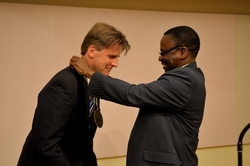 Ilesanmi Adesida, Vice Chancellor for Academic Affairs and Provost, honors Paul J. A. Kenis with the William H. and Janet G. Lycan Professorship in the School of Chemical Sciences. The investiture took place in late September.