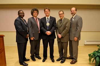 (From left to right): Ilesanmi Adesida, Vice Chancellor for Academic Affairs and Provost, Jonathan Sweedler, Director of the School of Chemical Sciences and Professor, Paul J.A. Kenis, William H. and Janet G. Lycan Professor and Department Head, Andrew Gewirth, Professor of Chemistry and former director of the School of Chemical Sciences, and Brian Ross, Interim Dean of the College of Liberal Arts and Sciences celebrate Kenis' investiture.