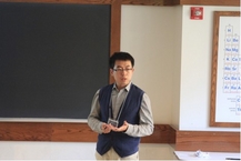 Tong giving his talk. Photo by Qilong Huang
