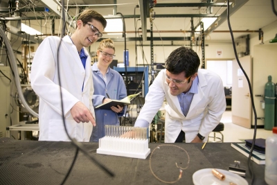 Chemical and Biomolecular Engineering Assistant Professor David Flaherty and graduate students Neil Wilson and Megan Witzke in Davenport Hall.