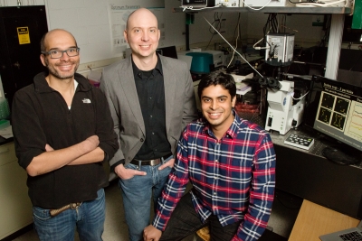 From left, Illinois professors Christopher Rao and Charles Schroeder with graduate student Anish Shenoy developed a new method for controlling multiple particles. Photo by L. Brian Stauffer.