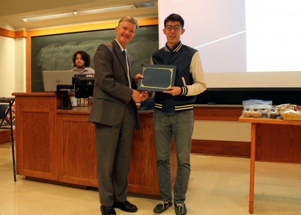 Prof. Seebauer awards second place to Pei-Chieh Shih for the poster competition.