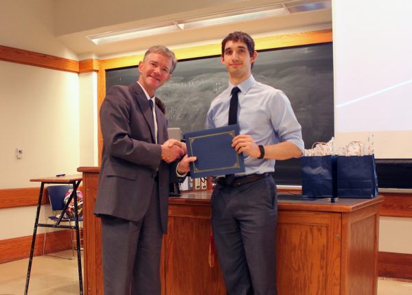 Prof. Seebauer awards Dylan Walsh first place for the oral presentation.