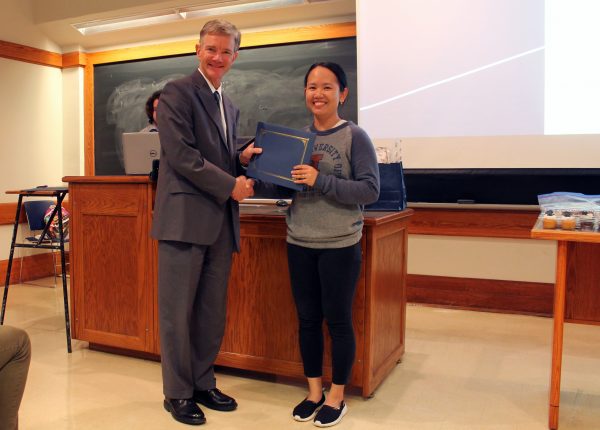 Prof. Seebauer awards Thao Ngo third place for the oral presentation.