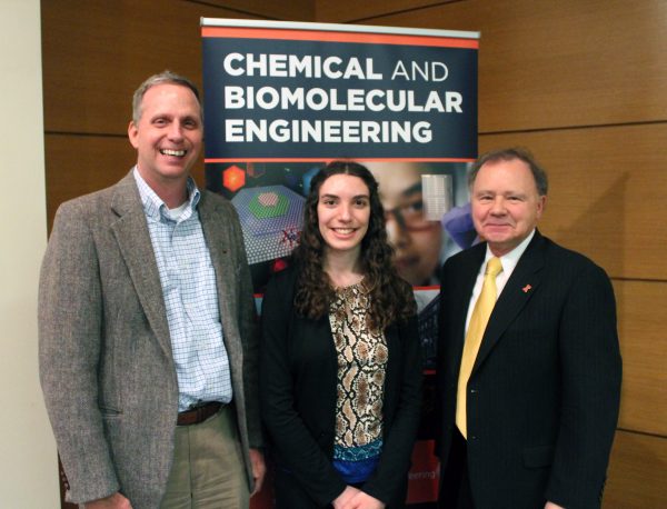 Research symposium judges Dan Hanus and Joe Drago with OXE president and symposium organizer Mikaela Dressendorfer.