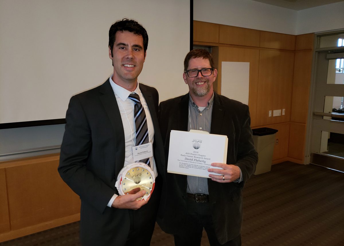 Daniel Killelea (right), chair of the AVS Prairie Chapter and professor in the Department of Chemistry at Loyola University Chicago, presents the Early Career Award to David Flaherty, assistant professor of chemical and biomolecular engineering at the University of Illinois (left).