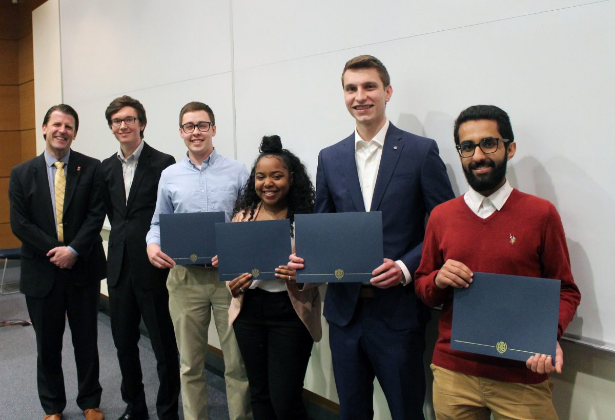 Department Head Dr. Paul Kenis with OXE President Pierce Blazina, Noah Hopkins, Ty&rsquo;Nya Larry, Kevin Wade and Faisal Aldukhi.