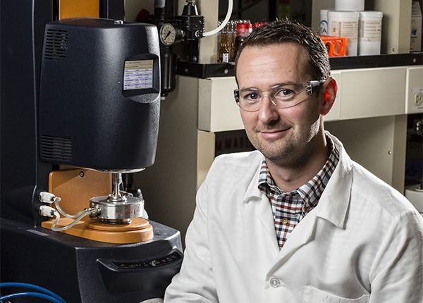 Simon Rogers, professor of Chemical and Biomolecular Engineering. With rheometer.