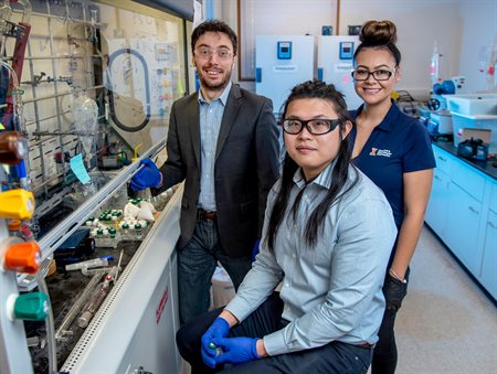 Chemical and biomolecular engineering professor Damien Guironnet and graduate students Vanessa DaSilva and Nicholas Wang demonstrated a new scalable process that can upcycle plastics. Credit: Heather Coit/University of Illinois