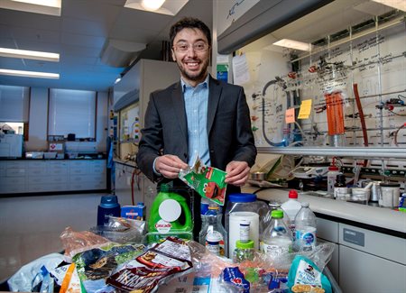 Professor Damien Guironnet, expert in polymer chemistry at Illinois, holds an example of multi-layer packaging that cannot be recycled. He is leading a new effort to create a new material that could be recycled or biodegrade. Credit: University of Illinois Urbana-Champaign