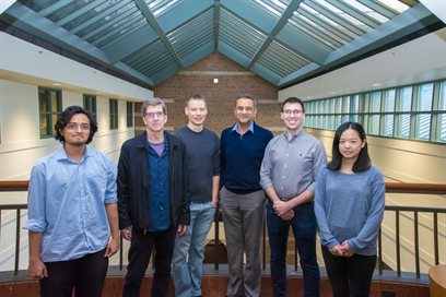 The interdisciplinary Beckman Institute team included (from left): Anirudha Rao, a graduate student in bioengineering; Scott Robinson, the former Beckman Institute Microscopy Suite Manager; Seth Kenkel, a postdoctoral research associate; Rohit Bhargava, a professor of bioengineering and the director of the Cancer Center at Illinois; Matthew Confer, a postdoctoral fellow; and Lin Chen, a graduate research assistant.