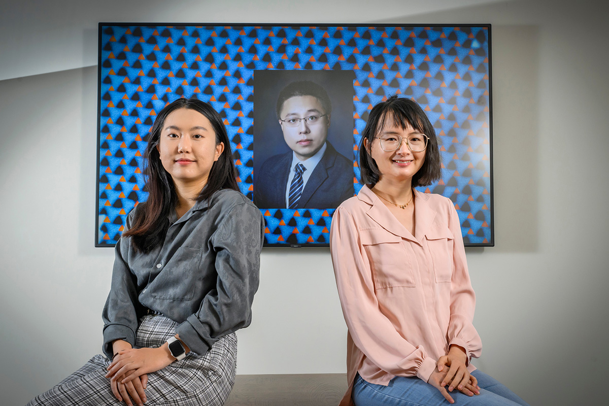 Jiahui Li, left, Shan Zhou and professor Qian Chen show off an electron micrograph image of their new pinwheel lattice structure developed to help engineers build new materials with unique optical, magnetic, electronic and catalytic properties.&nbsp;Photo by Fred Zwicky