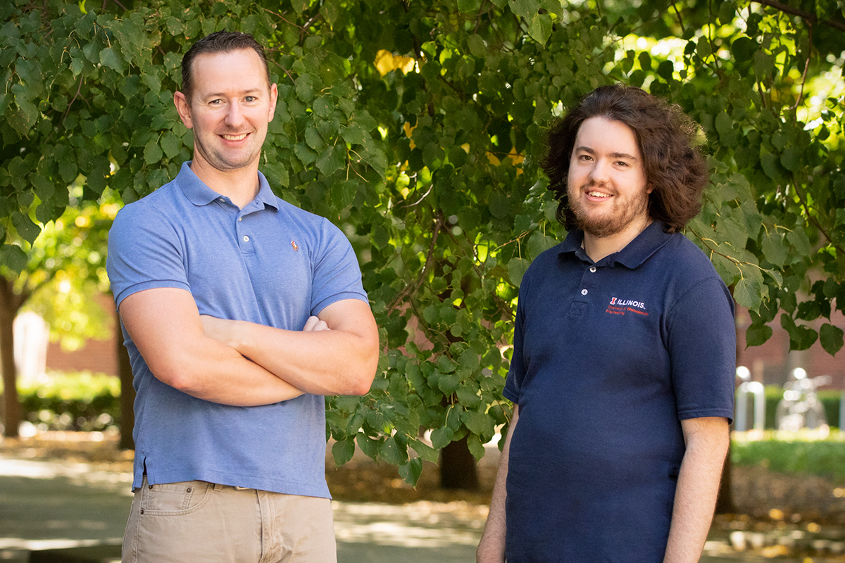 Professor Simon Rogers, and former Ilinois graduate student Gavin Donley stanfing infront of trees