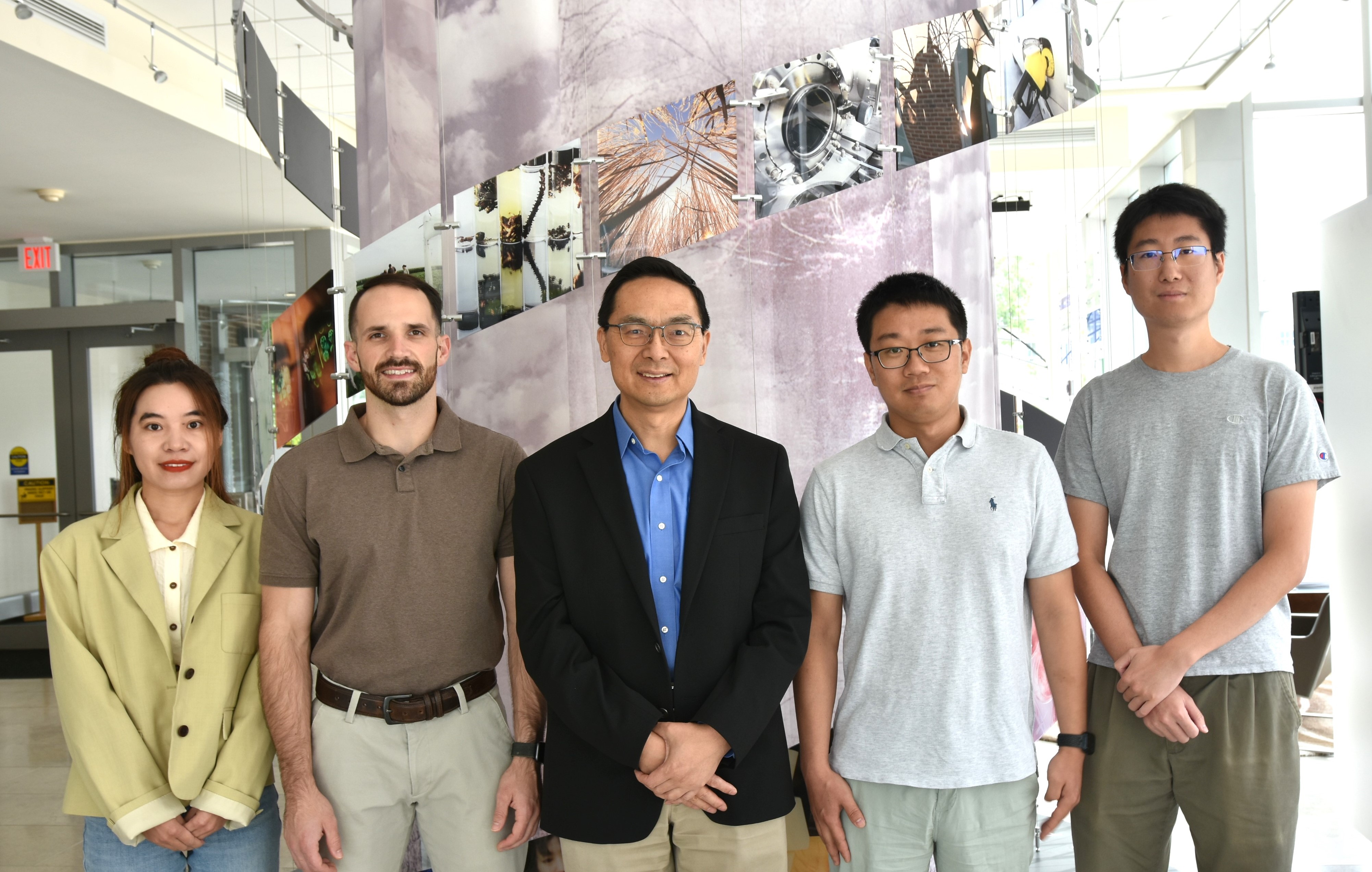 The University of Illinois research team, from left: Postdoc Yujie Yuan, Ph.D. Candidate Wesley Harrison, CABBI Conversion Theme Leader Huimin Zhao, Postdoc Maolin Li, and Postdoc Zhengyi Zhang. Credit: Julie Wurth/CABBI Communications