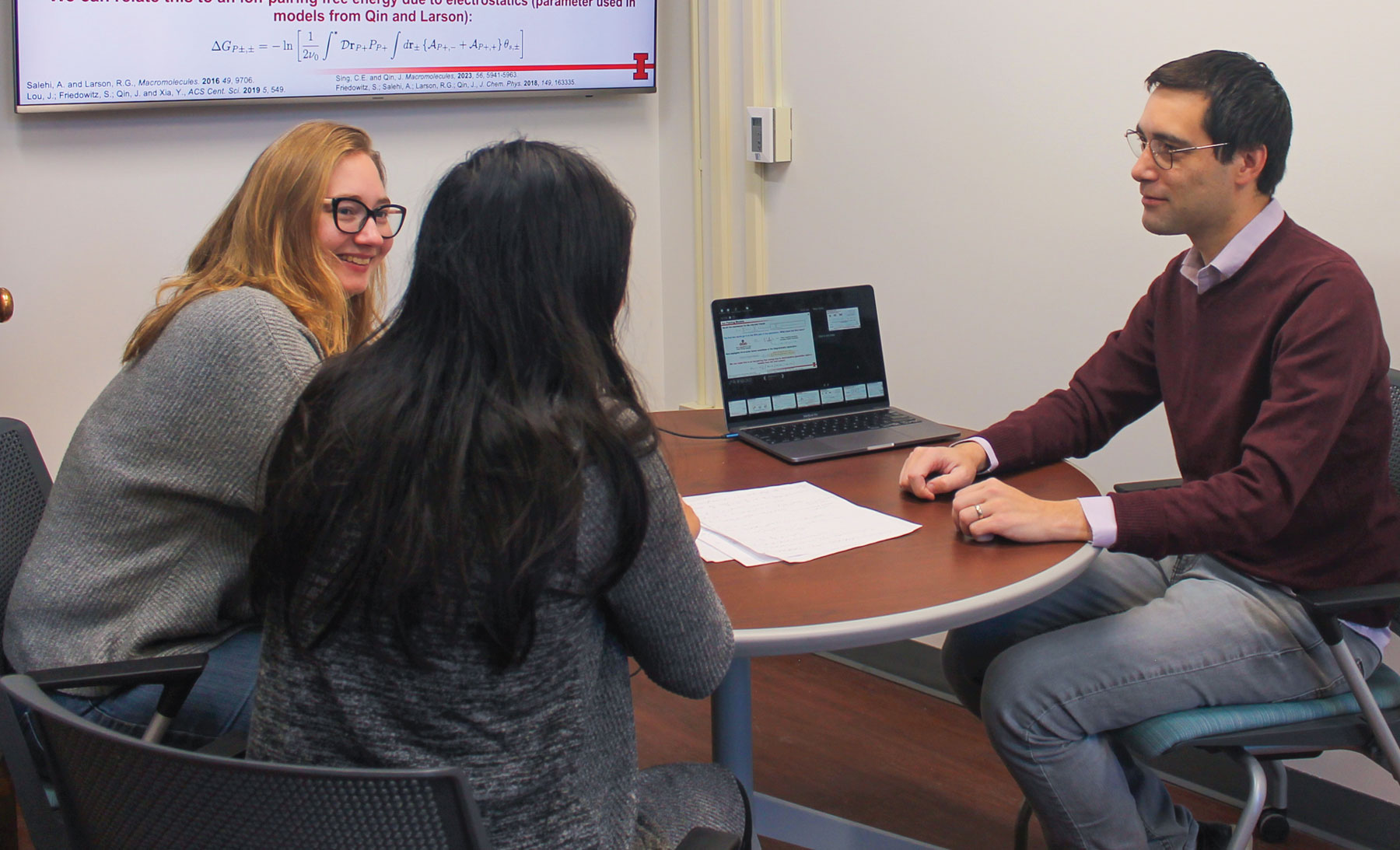 Charles Sing meets with former student Ashley Knoerdel and current student Siri Phuangthong.