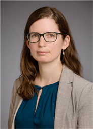 Headshot of Antonia Statt in a formal blouse and blazer.